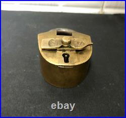 An Old Vintage Brass Unique Clock Hand Style Peg Padlock With Key