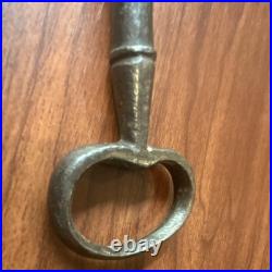 Large antique metal skeleton key with oval bow, old-style vintage key