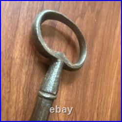 Large antique metal skeleton key with oval bow, old-style vintage key