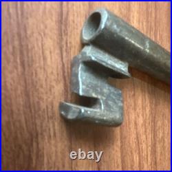Large antique metal skeleton key with oval bow, old-style vintage key