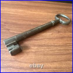 Large antique metal skeleton key with oval bow, old-style vintage key