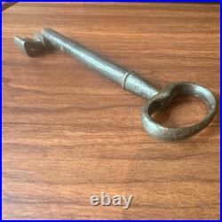 Large antique metal skeleton key with oval bow, old-style vintage key