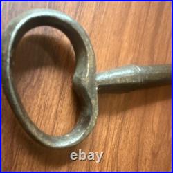 Large antique metal skeleton key with oval bow, old-style vintage key