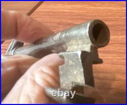 Large antique metal skeleton key with oval bow, old-style vintage key
