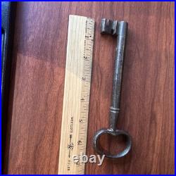 Large antique metal skeleton key with oval bow, old-style vintage key